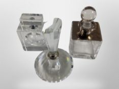 Three crystal perfume bottles, tallest 15cm.