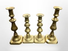 Two pairs of brass candlesticks,