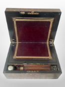 A late Victorian oak and brass-mounted writing slope with fitted interior,