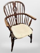 A 19th century elm Windsor armchair
