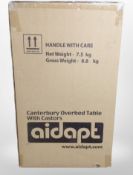 An Aidapt Canterbury over bed table with castors,