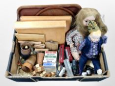 A box of 20th century teak serving trays, playing cards, leather dice cups, leather folders,