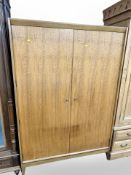 An A Younger Ltd teak double door wardrobe,