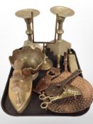 A group of brass and copper wares, large engraved brass candlesticks, iron, pedestal bowl,