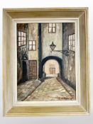 E Ericson : A road through an archway, oil on board, 33cm x 45cm.