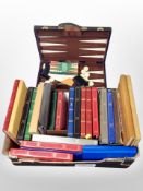 A box of bagatelle board and large quantity of empty photograph albums