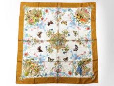 A Gucci silk scarf, 90cm square.