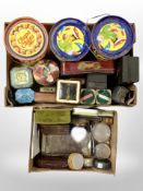 Two boxes containing vintage tins, brass money box in the form of a book, antique cash box,