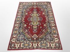 A machine-made rug of Persian design,