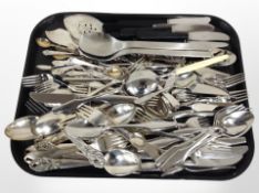 A large quantity of stainles steel cutlery.