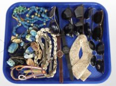 A group of costume bead necklaces including shell necklace, lady's and gents wristwatches,
