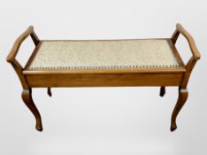 A stained beech duet stool,