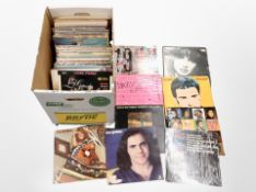 A box of assorted vinyl records,