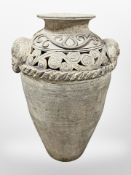 A large Eastern-style terracotta vase with elephant head handles, height 70cm.