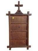 A carved oak hymn board,