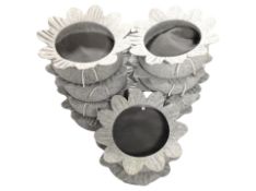 Ten cat beds in the form of flower heads,