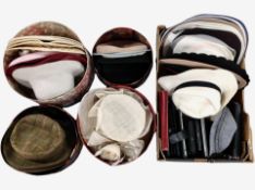 A collection of lady's hats and leather purses.