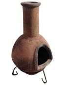 A terracotta chiminea,
