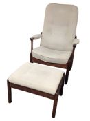 A 20th century stained beech armchair and matching footstool in button suede upholstery