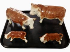 A Cooper Craft bull, cow and two calves.