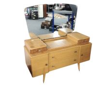 A mid 20th century walnut mirror backed dressing table,