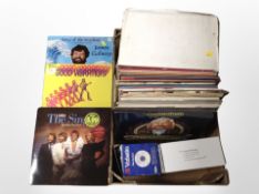 A box of Fujifilm digital camera, lp records,