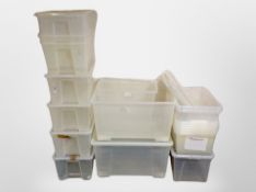 A quantity of plastic storage boxes