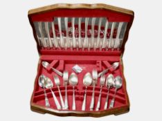 An oak canteen of EPNS cutlery.