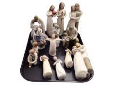 A group of Willow Tree figures.