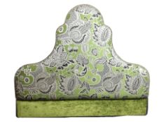 A contemporary upholstered headboard,