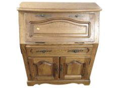 A reproduction oak bureau,