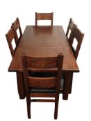 A contemporary stained oak extending dining table,