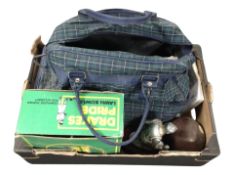 A box of assorted lawn bowls.