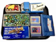A quantity of glass marbles, two Tonka tin plate trucks, a bridge box, hand magnifier, etc.