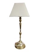 A brass table lamp,
