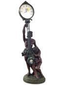 A resin figural quartz clock,