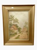 Leslie G Ireland : A rural road with thatched cottages, watercolour, 40cm x 27cm.