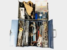 A crate and a concertina toolbox containing tools, hardware.