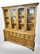 A contemporary display sideboard, fitted cupboards and drawers,