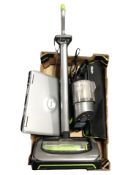 A Gtech upright vacuum cleaner, hand-held vacuum cleaner, laptop, etc.