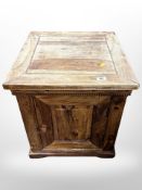A Mango wood pedestal cupboard,
