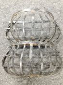 Two wall-mounted wrought-metal baskets, width 53cm.