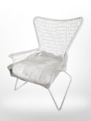 A white wicker garden armchair