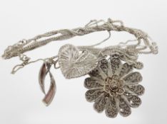 A silver and mother of pearl pendant on chain, further heart pendant and a Maltese silver pendant.