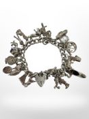 A silver charm bracelet CONDITION REPORT: 76.
