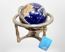 A gemstone globe fitted with a compass, height 32cm.