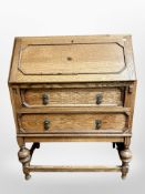 An Edwardian oak writing bureau,
