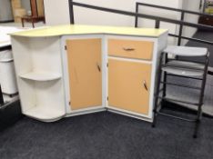 A 1960's melamine topped kitchen corner cabinet, 129 cm x 99 cm x 91 cm high,