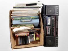 A Hitachi stereo, a Ferguson DVD player, and a box containing assorted LPs,