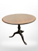 A 19th century carved mahogany bird cage action tilt topped table,